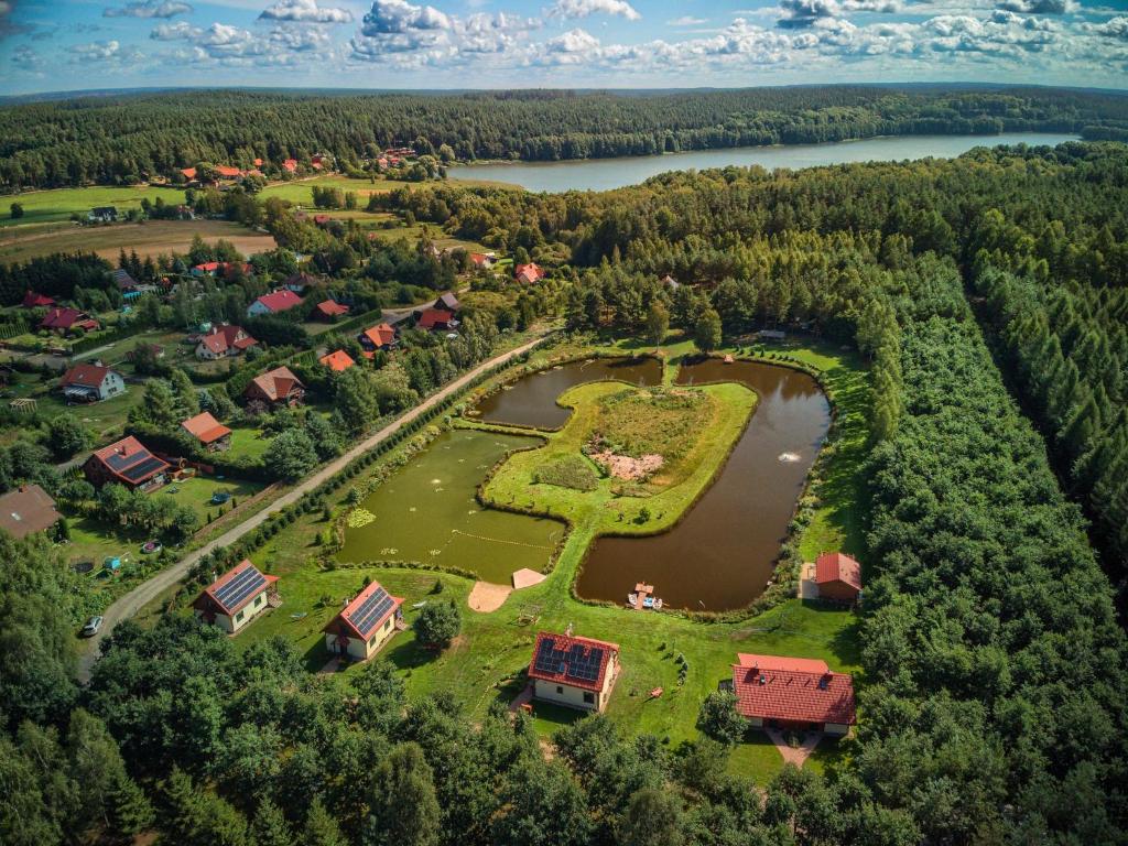 an aerial view of a park with a lake at Rentynówka in Gietrzwałd