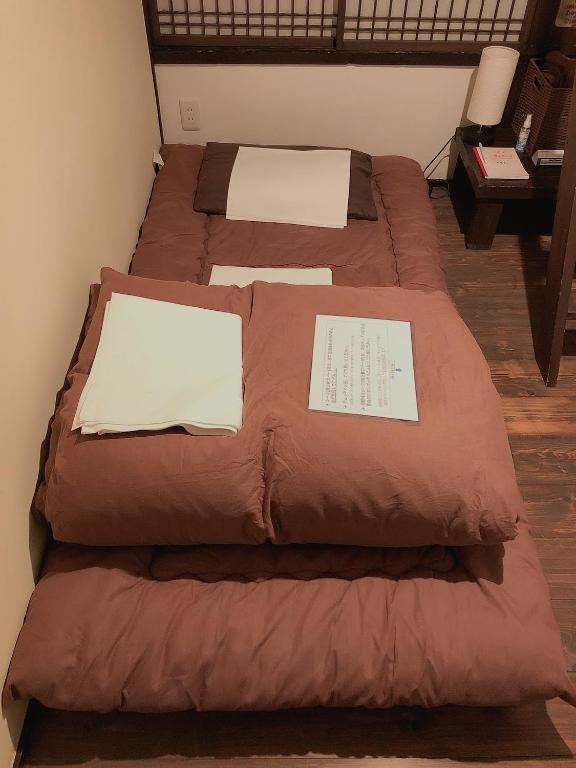Postel nebo postele na pokoji v ubytování Guest House KuKu