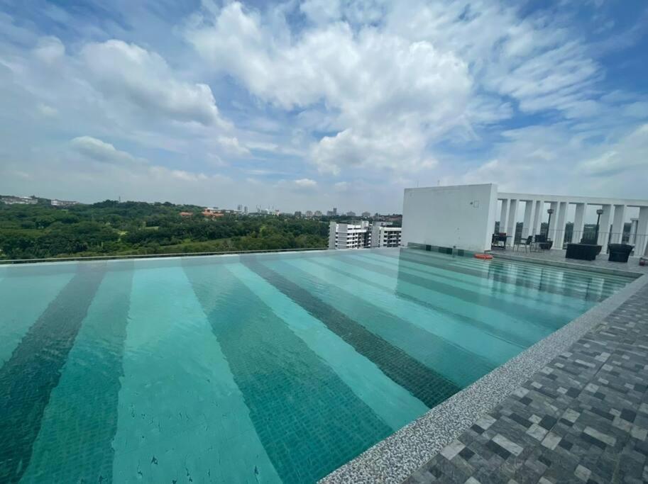 a swimming pool on the roof of a building at SGA SuriaJelutong in Shah Alam