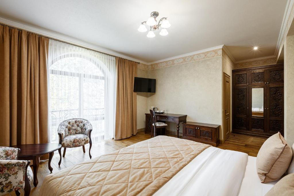 Postel nebo postele na pokoji v ubytování GANZ HOTEL