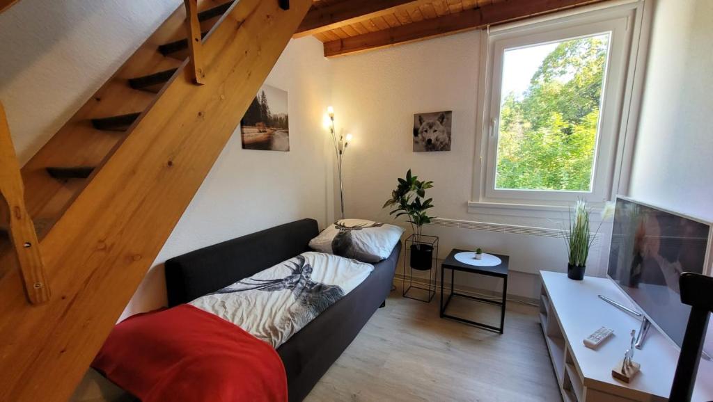 Postel nebo postele na pokoji v ubytování Berg-Büdchen - schnuckelige Maisonette-FeWo - gemütlich und günstig