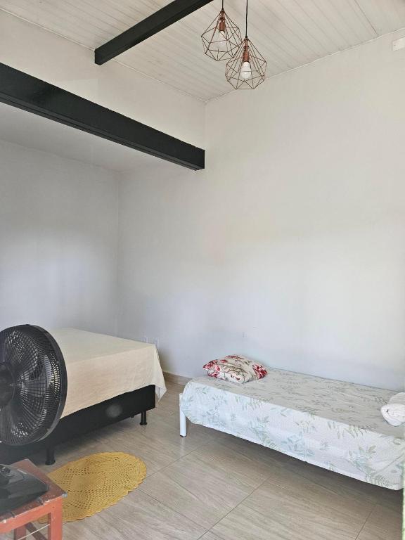Postel nebo postele na pokoji v ubytování Suítes Pirenópolis