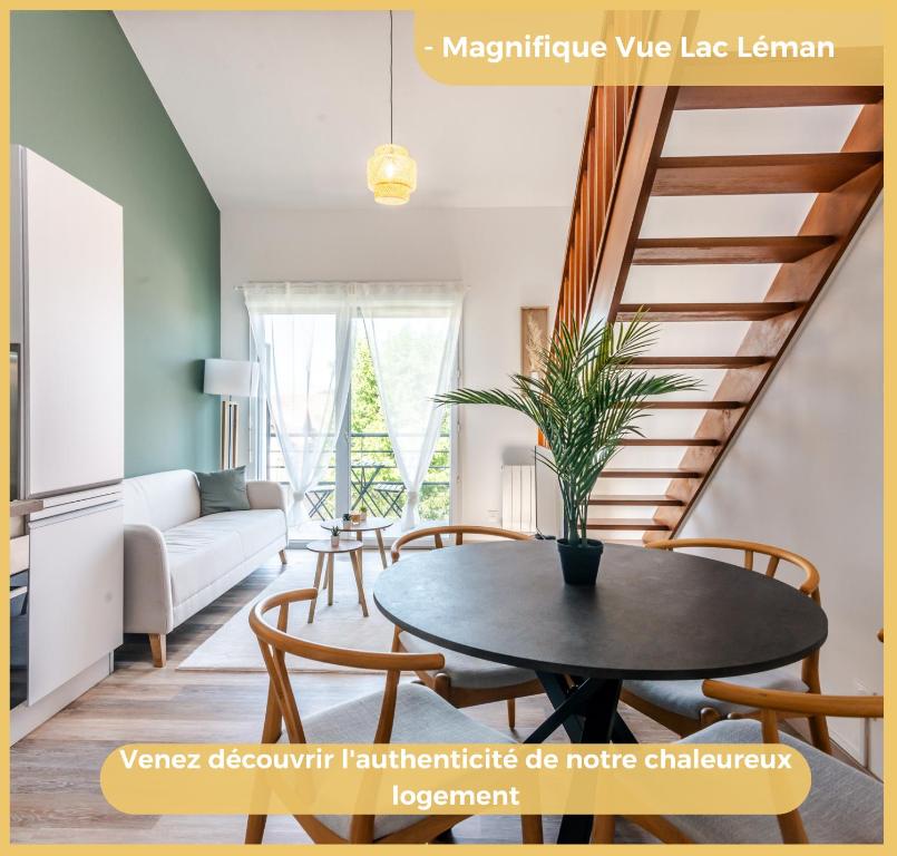 a living room with a table and a staircase at Appartement T2 Moderne Neuf Collonge in Collonges-sous-Salève