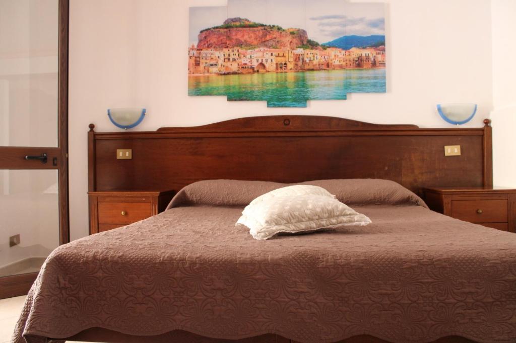 Postel nebo postele na pokoji v ubytování Hotel Grotticelli