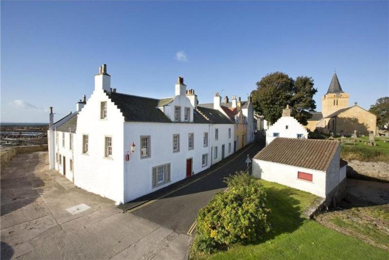 a group of white buildings sitting next to each other at Merchants House- stunning seaview period home in Anstruther