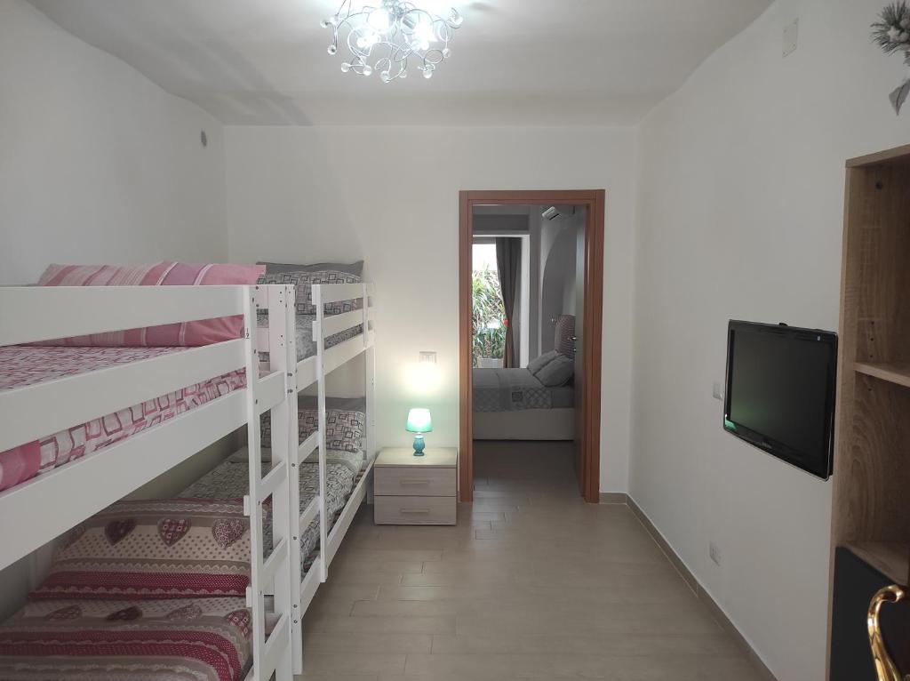 A bed or beds in a room at Affittacamere Silvagni