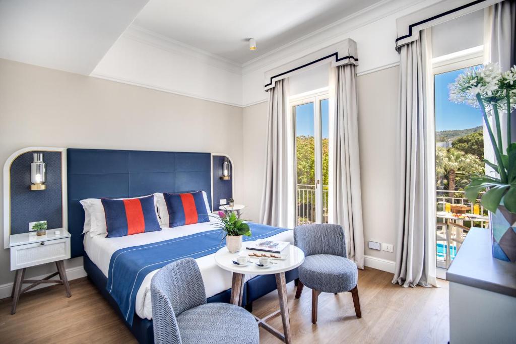 Postel nebo postele na pokoji v ubytování Hotel Mediterraneo