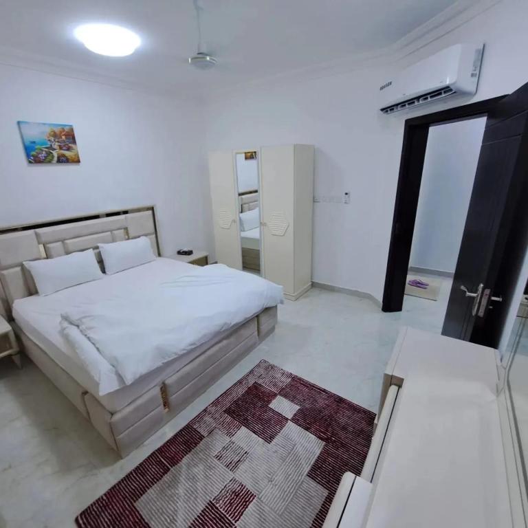 Postel nebo postele na pokoji v ubytování نسائم صلاله للشقق الفاخرة Nassayem Salalah Downtown
