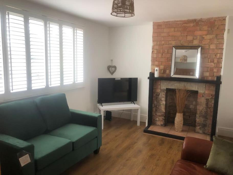a living room with a couch and a fireplace at Bellingham house 3 bedroom home in Brumby
