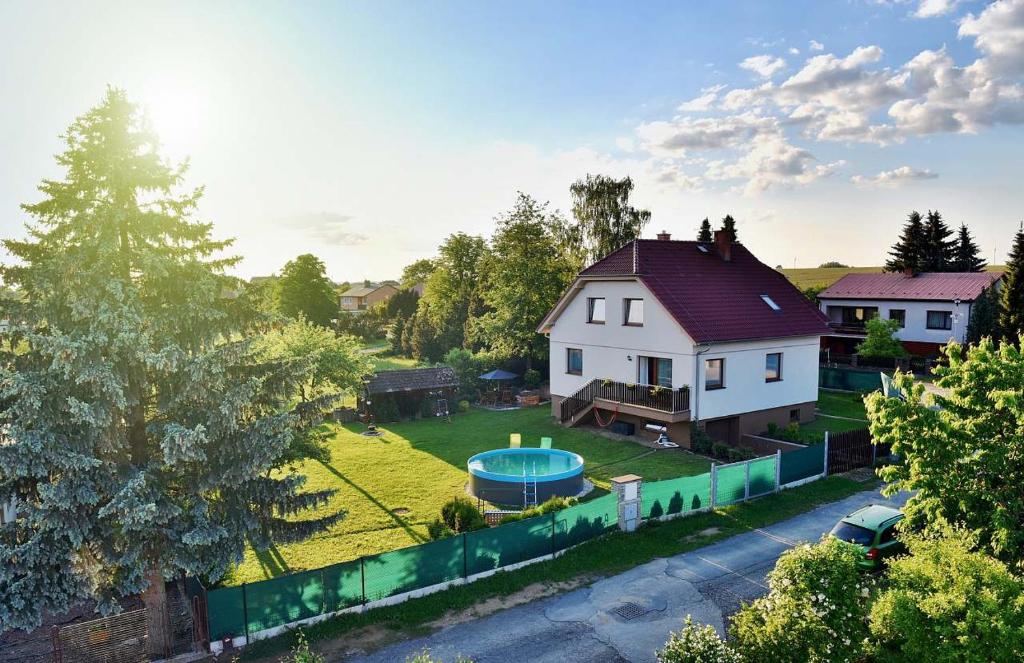 an aerial view of a house with a pool at Holiday house Malšice in Malšice