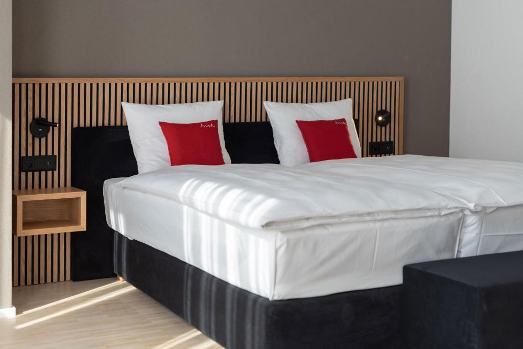 Letto o letti in una camera di Tailormade Hotel BAB Bachenbülach