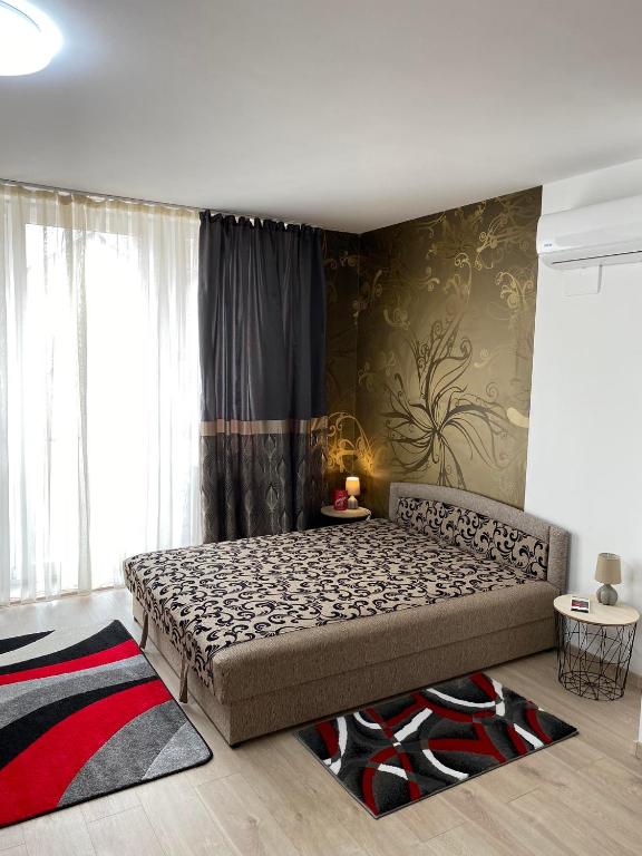 a bedroom with a large bed in a room at Danka Szálláshely in Debrecen