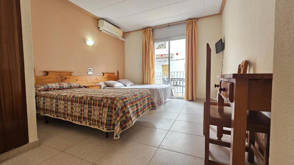 Posteľ alebo postele v izbe v ubytovaní Hostal Los Maños