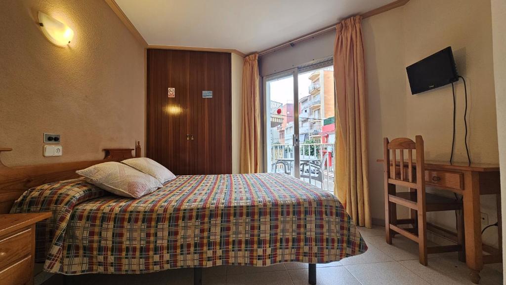 Posteľ alebo postele v izbe v ubytovaní Hostal Los Maños