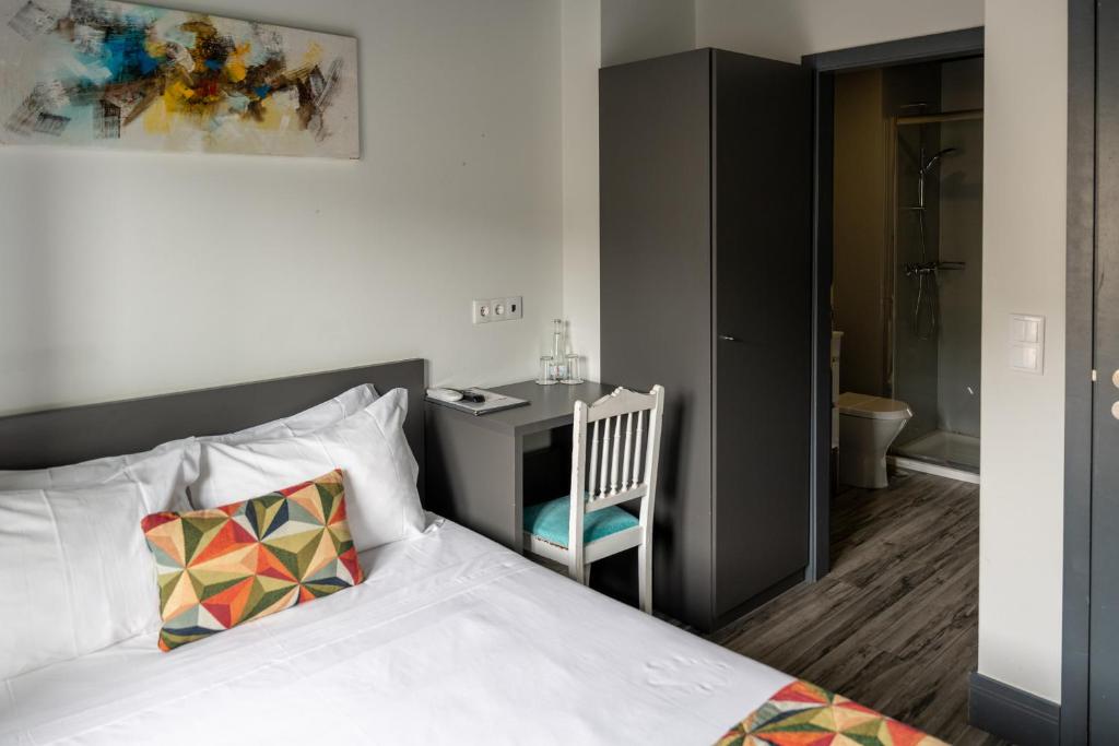 Postel nebo postele na pokoji v ubytování Residencial Kuarenta&Um
