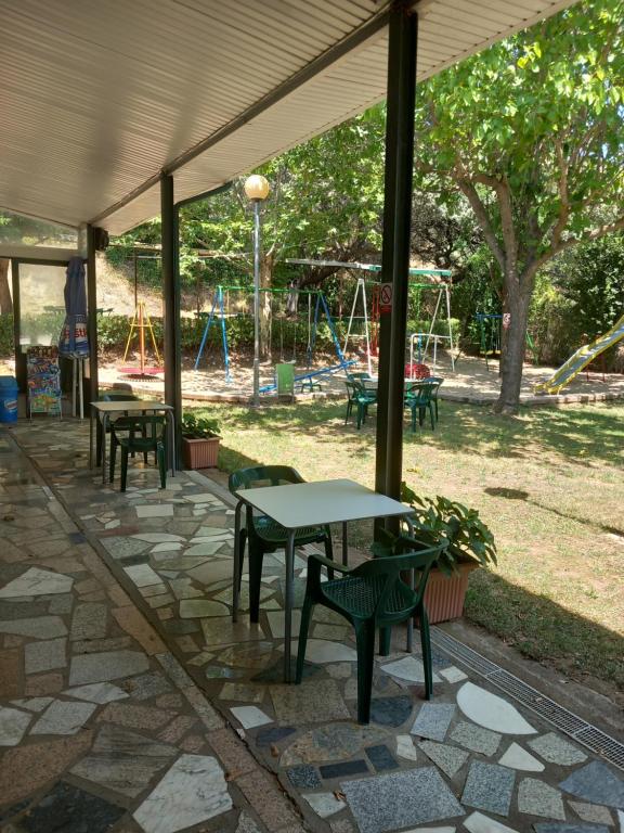 A garden outside Bungalows, Camping Vega de Francia