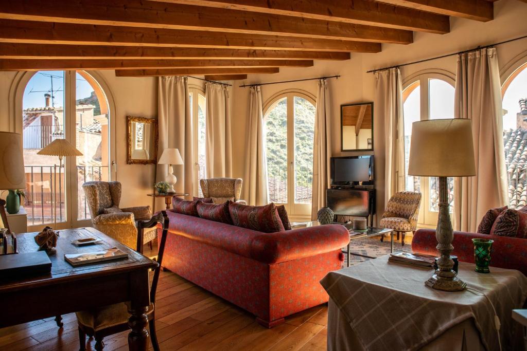 a living room with a couch and a table at Cardona Luxury Penthouse by Duquessa Hotel Collection in Cardona