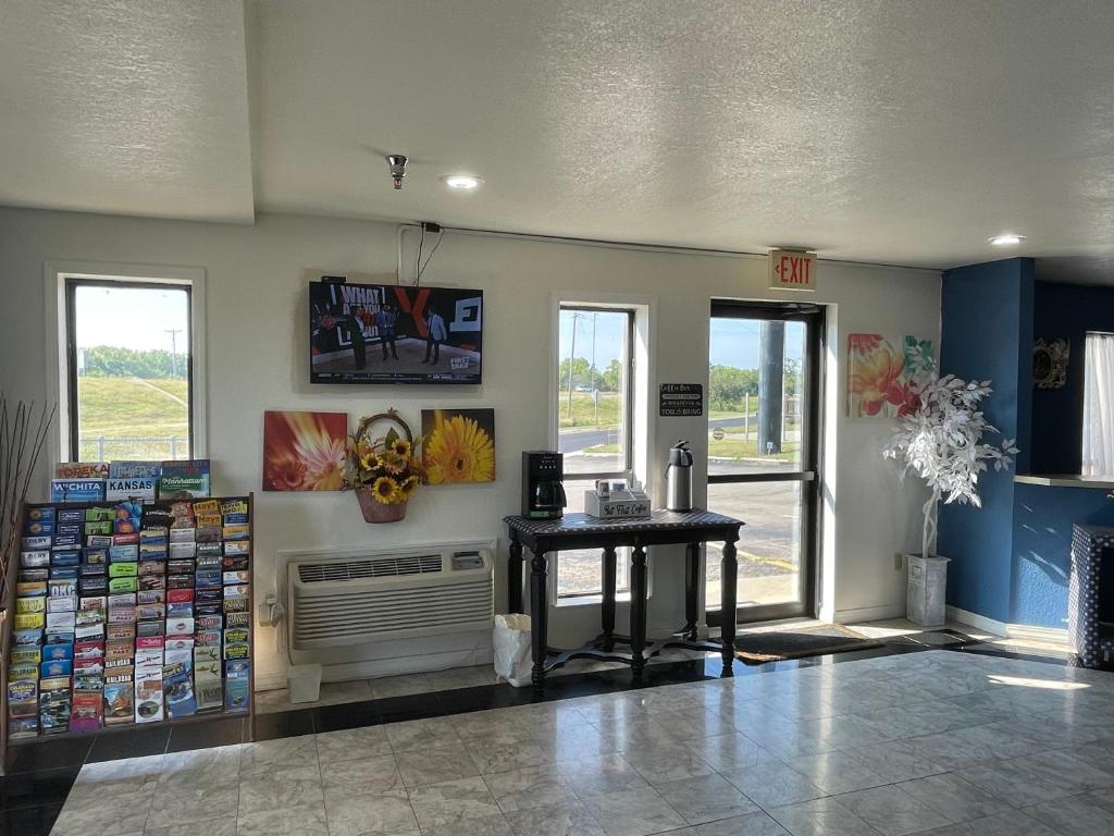 a store lobby with a table and windows at Express extended in Junction City