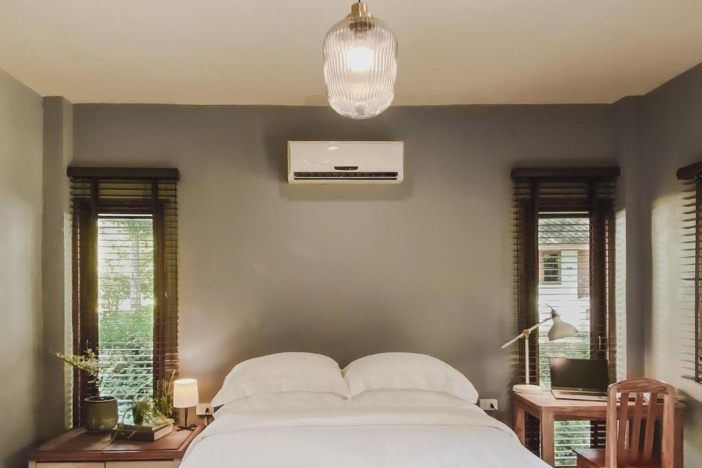 Postel nebo postele na pokoji v ubytování Re Connect Pai - Keys Resort