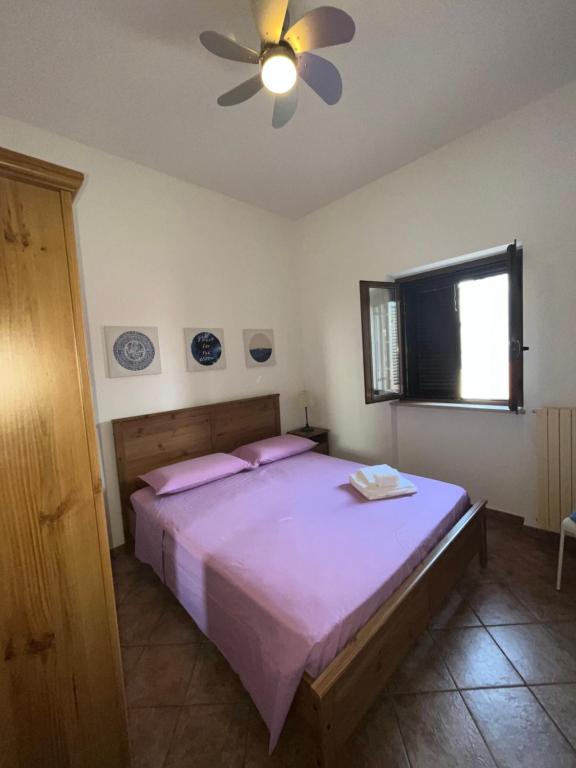 Postel nebo postele na pokoji v ubytování Gorgo Rinaldi - Locazioni brevi