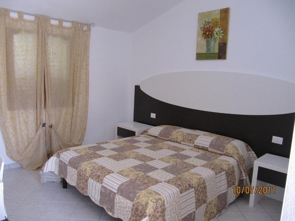 Posteľ alebo postele v izbe v ubytovaní Residence Olbia