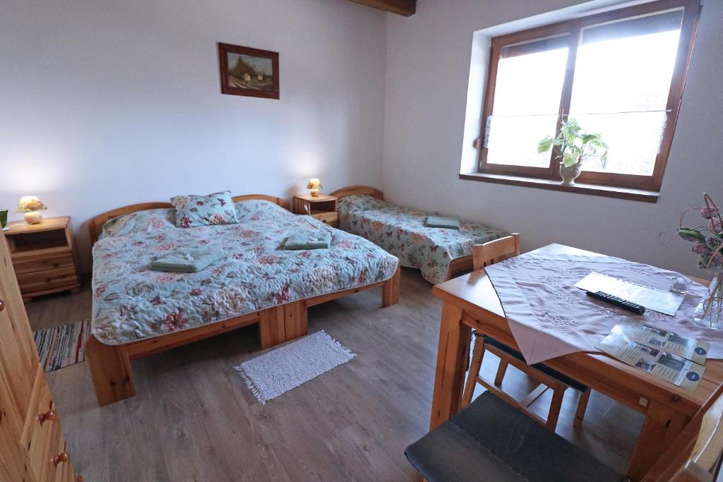 Postel nebo postele na pokoji v ubytování Füzesi Papa Vendégháza