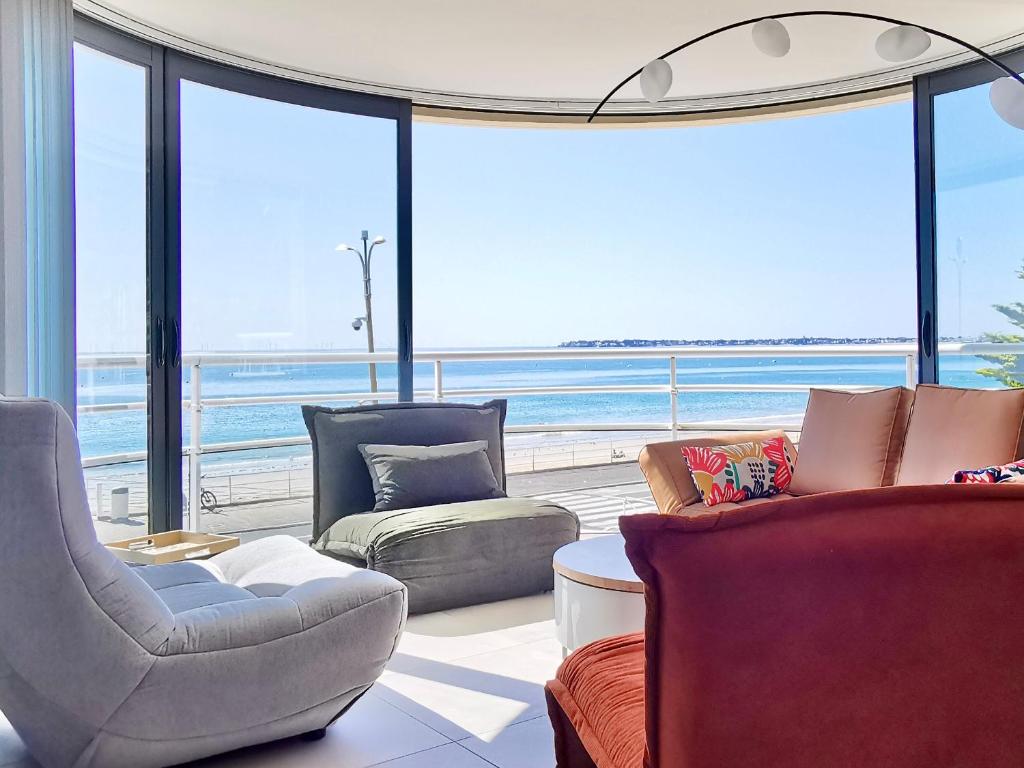 a living room with a view of the ocean at Vue sur mer La Baule Soléa in La Baule