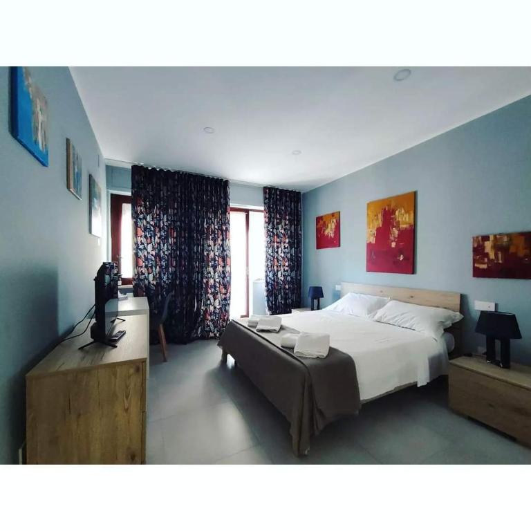 Postel nebo postele na pokoji v ubytování GArt Riviera B&B