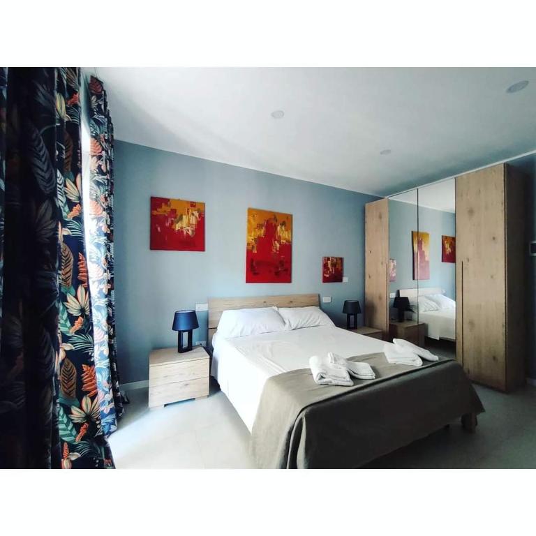 Postel nebo postele na pokoji v ubytování GArt Riviera B&B