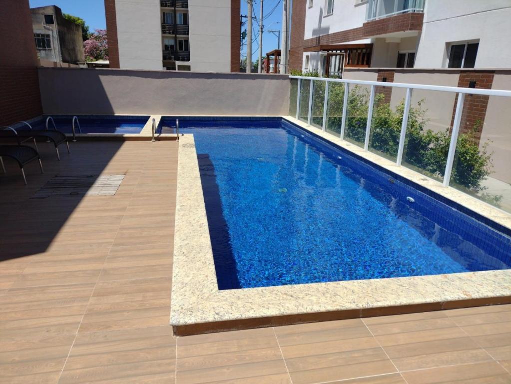 a swimming pool on the side of a building at Vista mar no ultimo andar! in Ilhéus
