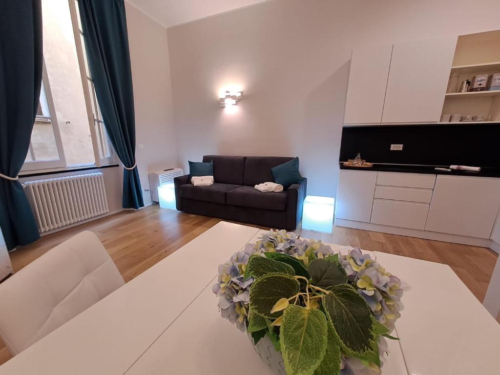 a living room with a couch and a table at La dimora dei Rolli in Genoa