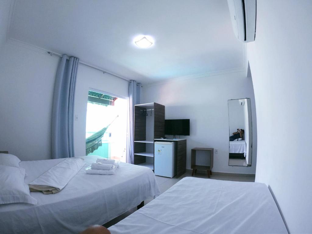 Postel nebo postele na pokoji v ubytování Hotel Pousada Oasis