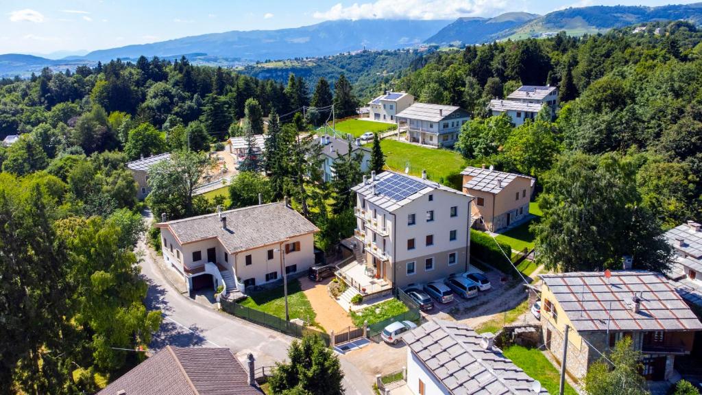 an aerial view of a large house in the mountains at Casa Coletta in Bosco Chiesanuova