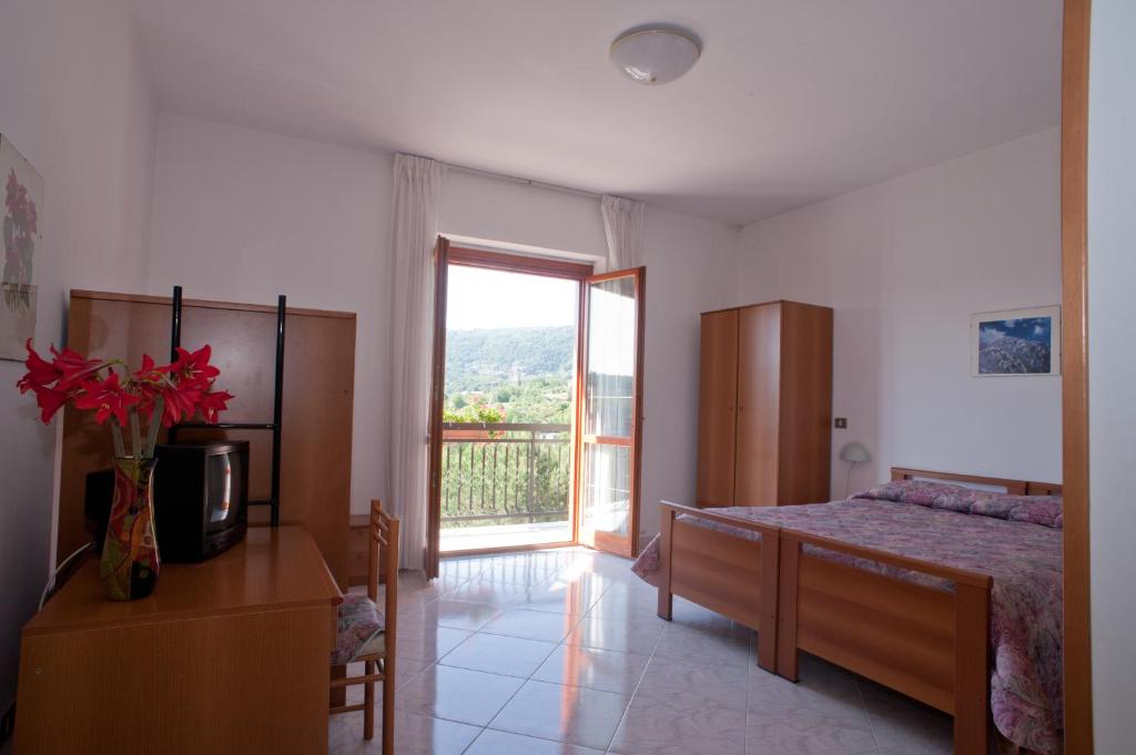 Postel nebo postele na pokoji v ubytování B&B Le Ginestre