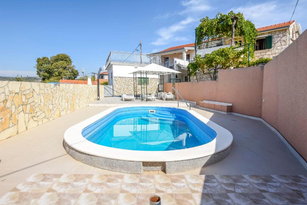 a swimming pool in the backyard of a house at House Neda in Ražanj