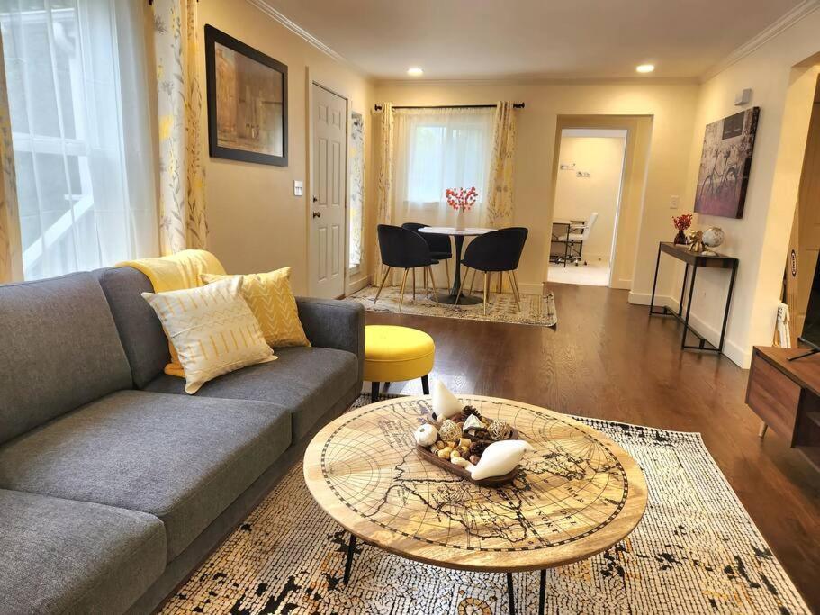 a living room with a couch and a table at Cozy contemporary 2BR with Sofa bed in the office in Seattle