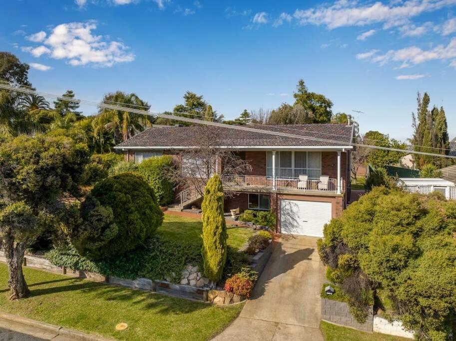 an overhead view of a house with a driveway at Views on Quicks Hill in Lavington