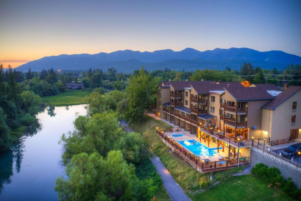 an aerial view of a resort with a river at The Pine Lodge on Whitefish River, Ascend Hotel Collection in Whitefish