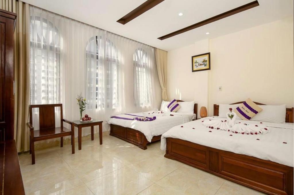 Postel nebo postele na pokoji v ubytování T Y Hotel