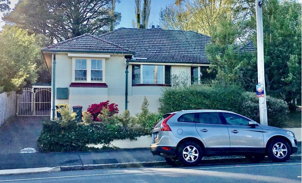 a silver car parked in front of a house at Lurline Lodge in Katoomba