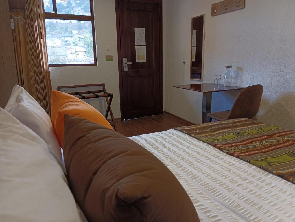 Postel nebo postele na pokoji v ubytování Casona Tobar Hotel