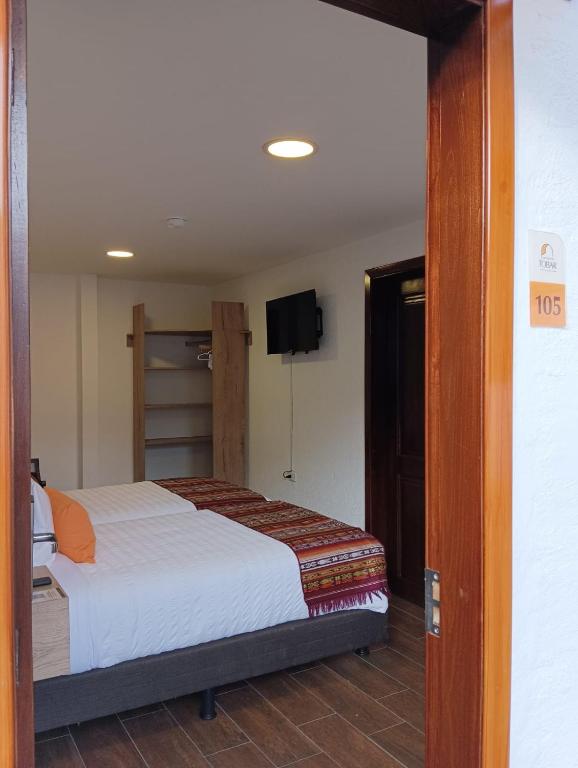 Postel nebo postele na pokoji v ubytování Casona Tobar Hotel