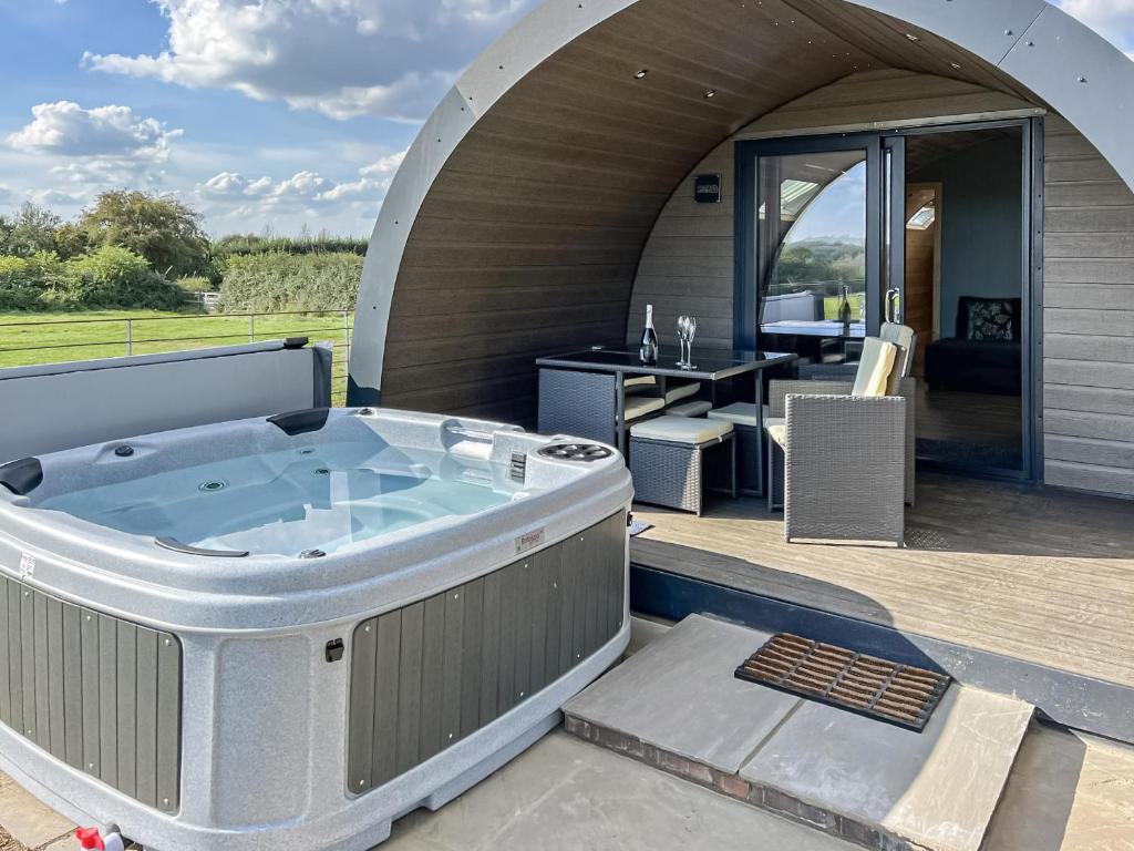 a large hot tub on a deck with a patio at Vale View - Uk43774 in South Barrow