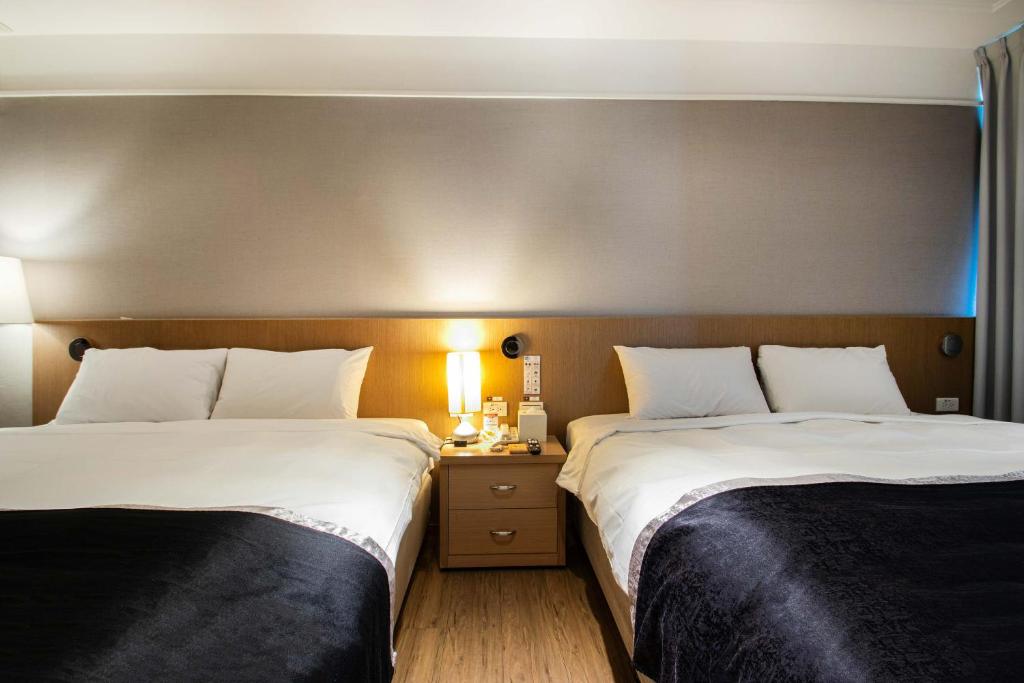 Postel nebo postele na pokoji v ubytování Stay Inn 2