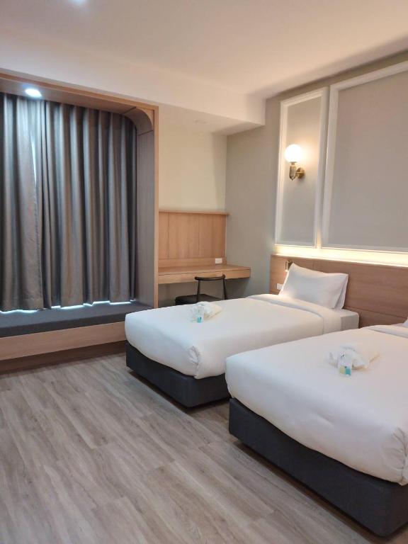 Mayflower Grande Suite Hotel - Deluxe Twin Room