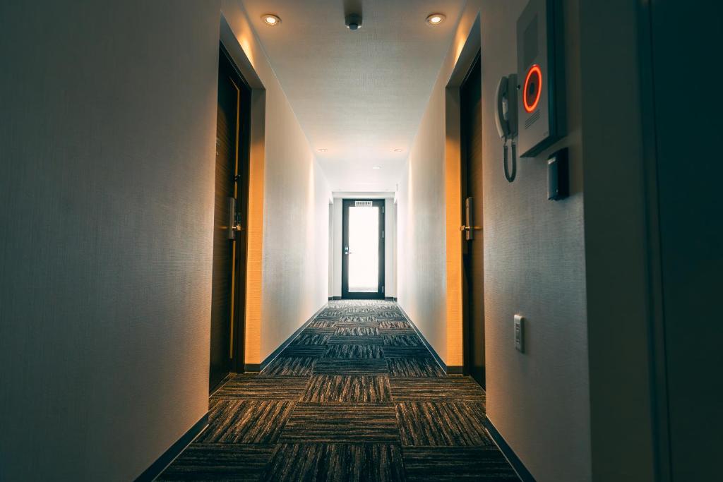 Postel nebo postele na pokoji v ubytování R Hotel Honmachi