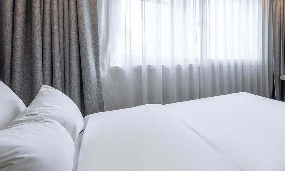 Postel nebo postele na pokoji v ubytování Anyang ILLOWA Hotel