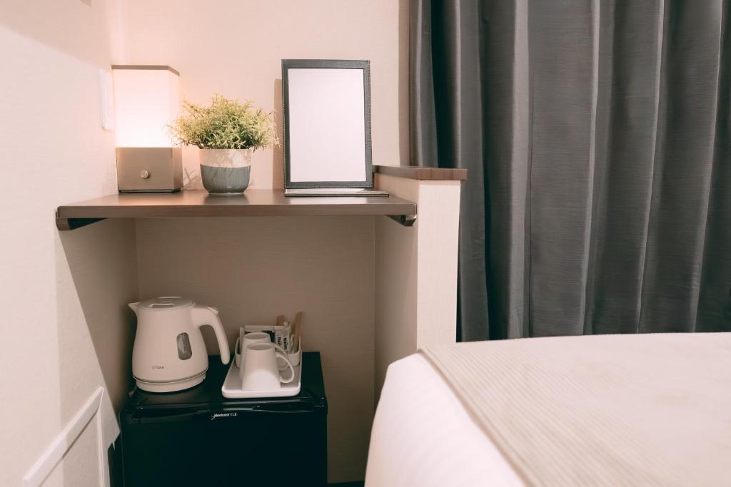 Postel nebo postele na pokoji v ubytování R Hotel Honmachi