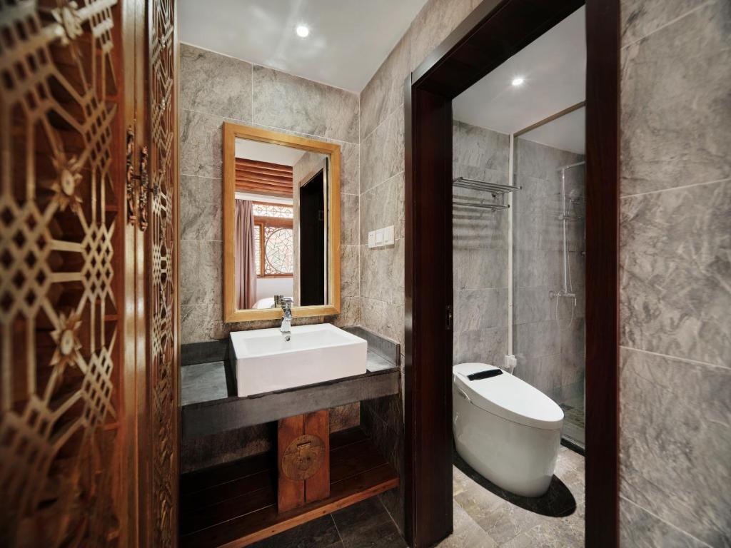 Koupelna v ubytování 夕露小榭古城南门店 Xilu Xiaoxie Inn Old Town Lijiang