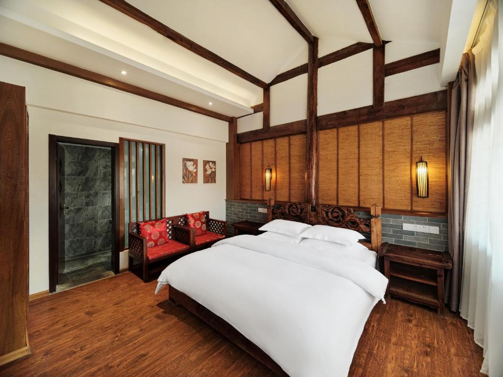 Postel nebo postele na pokoji v ubytování 夕露小榭古城南门店 Xilu Xiaoxie Inn Old Town Lijiang